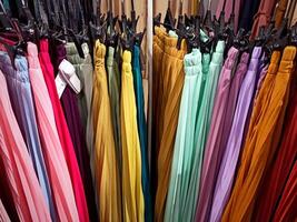 Colorful skirts displayed in fashion store photo