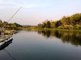 Beautiful view of a river with calm water and reflection of sky photo