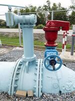 The large iron pipe with the control valve. photo