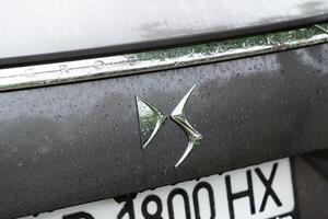 Kyiv, Ukraine - April, 2024. Ds 7 Crossback exterior car close-up logo with water drops photo