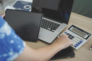 person using digital tablet in office photo