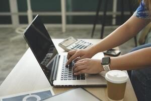 person using digital tablet in office photo