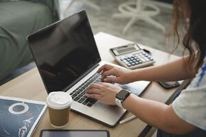 person using digital tablet in office photo