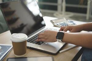 person using digital tablet in office photo