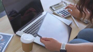 person using digital tablet in office photo