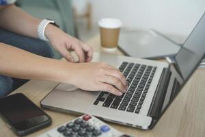 person using digital tablet in office photo