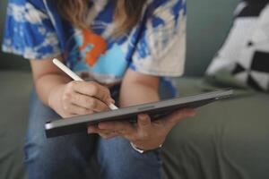 person using digital tablet in office photo