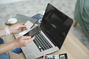 person using digital tablet in office photo