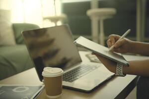 person using digital tablet in office photo