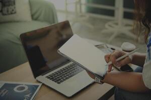 person using digital tablet in office photo