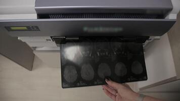 Specialized Printer prints a snapshot taken using magnetic resonance imaging video