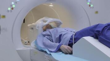 The girl patient during the study using magnetic resonance imaging. Innovative technologies in medicine video