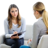 Professional female counselor discussing with client on couch png