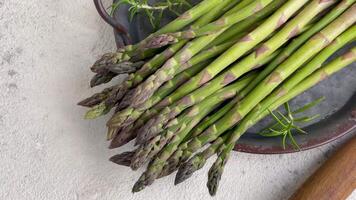 Bunches of green raw garden asparagus. video