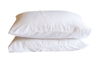 Side view of two white pillows in stack after use in hotel or resort room isolated with clipping path in file format png