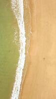 Top View Of Crystal Clear Ocean Waves On Sandy Beach, Natural Background. video