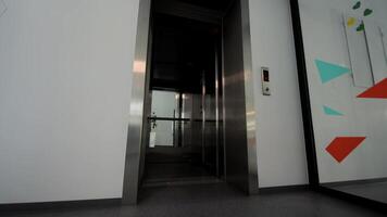 The doors of the office elevator close. The passenger elevator is empty without people. video