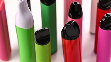 Set Of Colorful Disposable Electronic Cigarettes Of Different Shapes On A White video