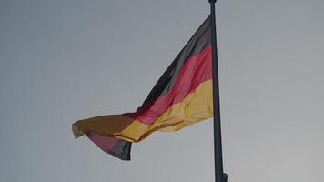 The National Flag of Germany with Blue Sky on Background in Slow Motion video