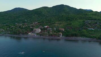 village coast at green mountains view seaside landscape blue ocean drone video