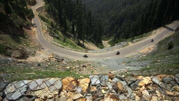 Motorcyclists riding on a mountain road in Tibet video