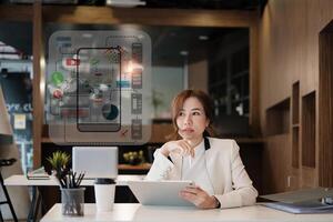 Female ux developer and ui designer sketching interface app in digital tablet in living room at home. Creative digital development agency concept. photo