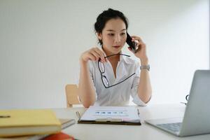 Secretary answering telephone and make an appointment client. photo