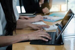 Group of Businessman and Accountant checking data document on digital tablet for investigation of corruption account . Anti Bribery concept. photo