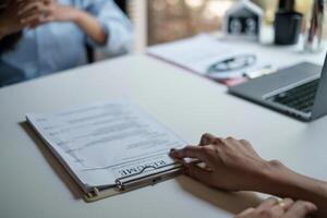 Employer reviewing good cv of prepared skilled applicant. HR manager making hiring decision. Interview concept. photo