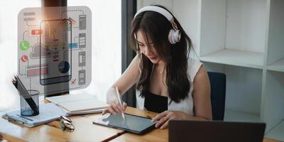 Female ux developer and ui designer sketching interface app in digital tablet in living room at home. Creative digital development agency concept. photo