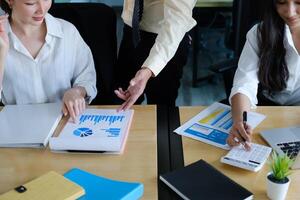 Fund managers team consultation and discuss about analysis Investment stock market by digital tablet. photo