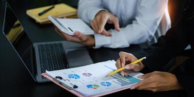 Group of Businesswoman and Accountant checking data document on digital tablet for investigation of corruption account . Anti Bribery concept. photo