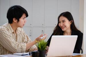 At the corporate headquarters, a business team works and discusses in a private meeting room. photo