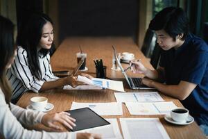 Group of business people discuss current financial and economic paperwork for investment at the meeting. Analytics intelligence concept. photo