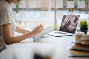 User experience concept. Creative Web Designer sketching application and developing template layout on laptop, framework for digital devices. photo