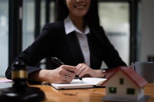 Close up lawyer businessman working or reading lawbook in office workplace for consultant lawyer concept. photo