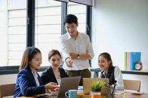 Group of Businesswoman and Accountant checking data document on digital tablet for investigation of corruption account . Anti Bribery concept. photo