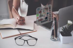 A close-up of an ux ui developer and an ui designer working on a mockup icon interface for a mobile app. photo