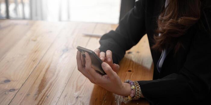 A businesswoman completes KYC using an online banking program in order to open a digital savings account. The definition of cyber security. photo