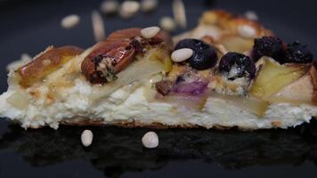 pie, selection of various snacks of cheese and fresh pears, sprinkle with pine nuts, tasty and healthy food, slow motion video