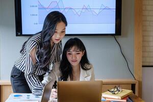 Group of Businesswoman and Accountant checking data document on digital tablet for investigation of corruption account . Anti Bribery concept. photo