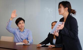 Businessman asking questions to the speaker during the briefing. Man Has Question During Presentation. photo