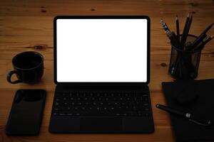 White blank screen digital tablet on modern working desk. photo