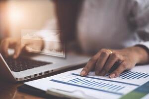 Fund Investor analyzing stock market report making audit financial dashboard with business intelligence BI. Fintech concept. photo
