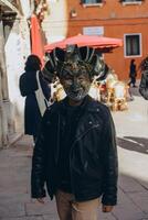 Plague doctor mask, typical mask of the Venetian carnival, Italy photo