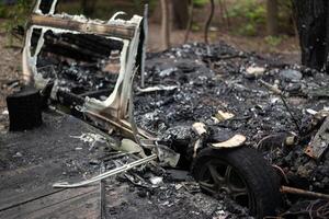 The remains of a burnt out mobile home trailer. photo