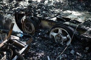 The remains of a burnt out mobile home trailer. photo