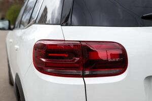 Kyiv, Ukraine. April 6, 2024. Citroen C5 Aircross is a compact crossover SUV. Closeup of rear light taillight on white car photo