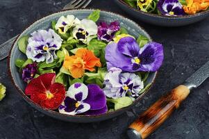 Trendy salad made only from edible flowers. photo