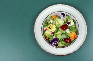 Healthy vegetables salad with flowers. photo